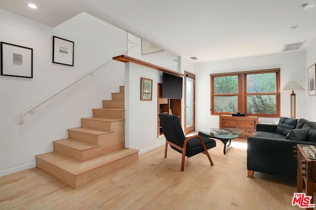 living room with light hardwood / wood-style floors