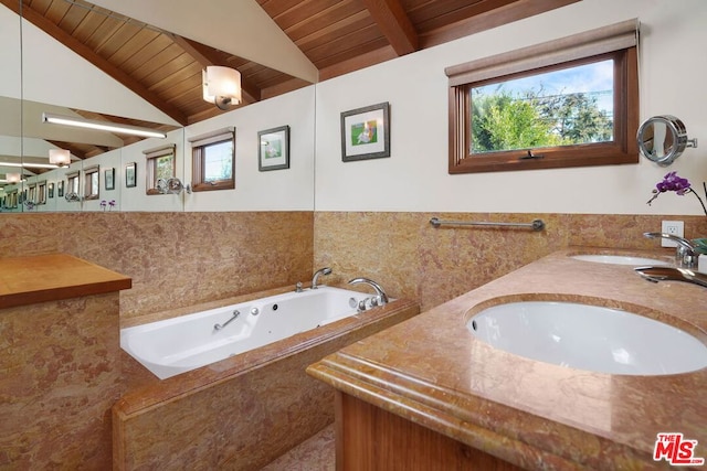 bathroom featuring vanity, a relaxing tiled tub, wood ceiling, and lofted ceiling with beams