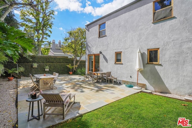 rear view of house featuring a patio