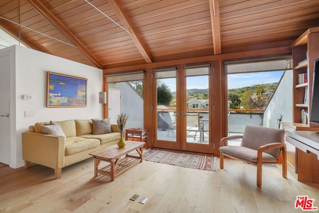 interior space with french doors, vaulted ceiling with beams, and wooden ceiling