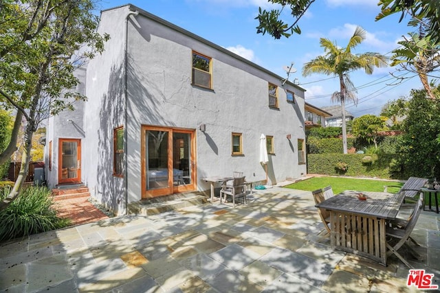 back of house with a patio area