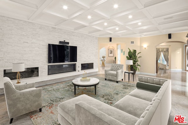 living room with beamed ceiling and coffered ceiling