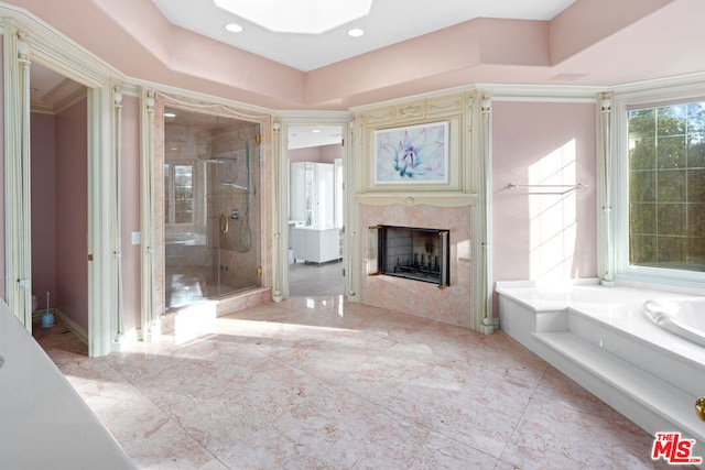 bathroom featuring plus walk in shower, a premium fireplace, and tile patterned floors