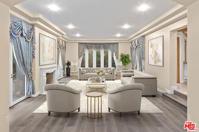 living room featuring ornamental molding and hardwood / wood-style floors