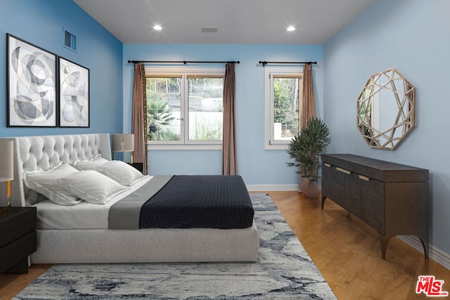 bedroom with light hardwood / wood-style flooring