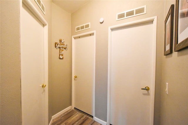 hallway featuring dark hardwood / wood-style floors