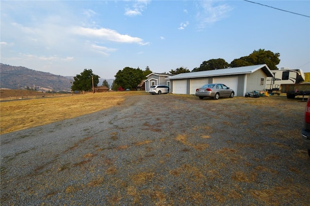 exterior space with a mountain view and a garage