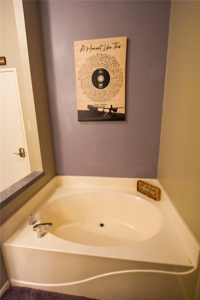 bathroom with a tub to relax in