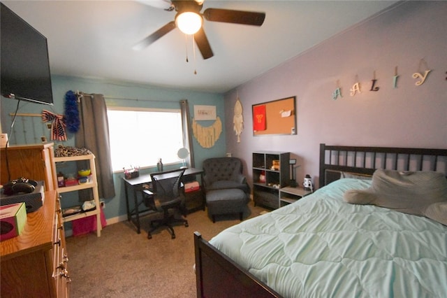 bedroom featuring lofted ceiling, ceiling fan, and light colored carpet