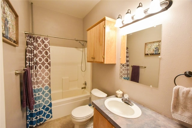 full bathroom with vanity, shower / tub combo, and toilet