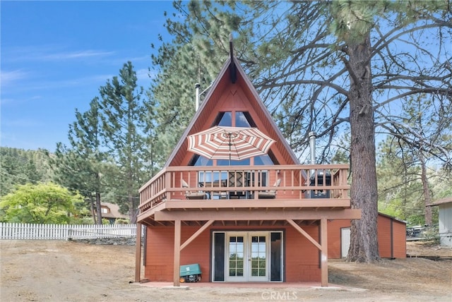 back of property featuring french doors and a wooden deck