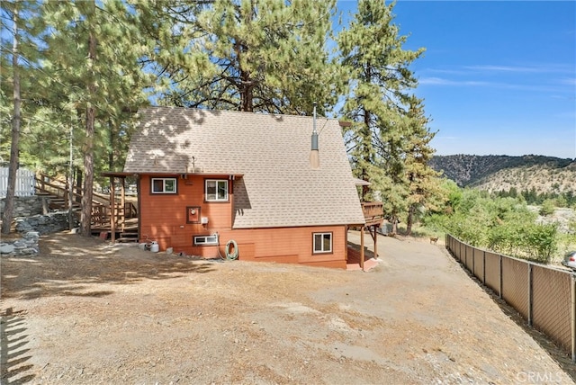 back of house featuring a mountain view