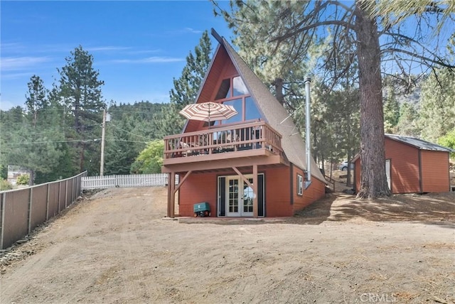 1830 W Ash Rd, Wrightwood, CA 92397 - rear view of property with french doors, a deck, and fence