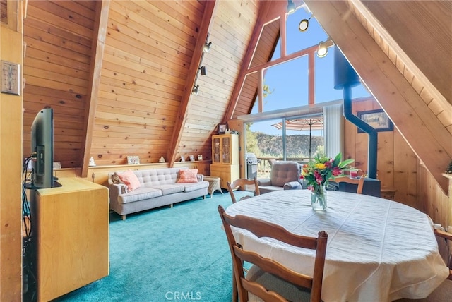 interior space featuring wood ceiling, high vaulted ceiling, carpet flooring, and wooden walls