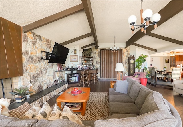 living room with wood-type flooring, vaulted ceiling with beams, a textured ceiling, and ceiling fan with notable chandelier