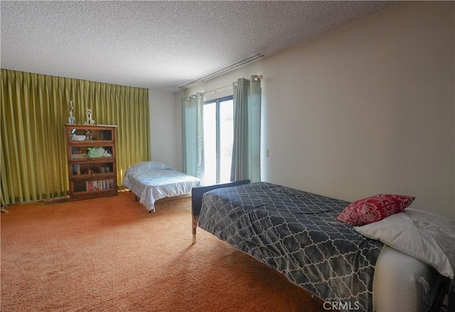 carpeted bedroom with a textured ceiling