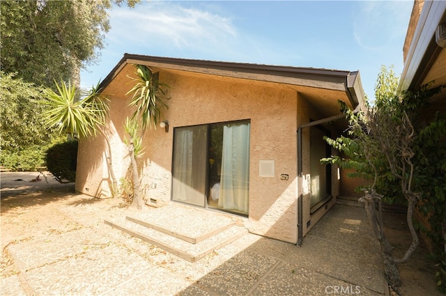 rear view of property with a patio area