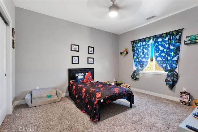 bedroom with ceiling fan, a closet, and carpet flooring