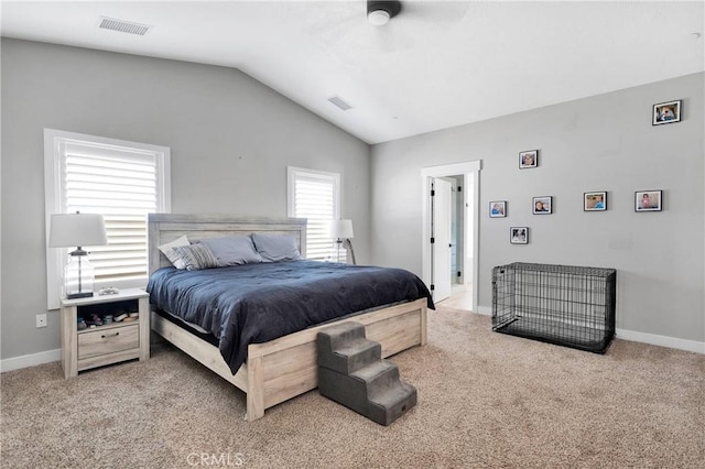 carpeted bedroom featuring ceiling fan and vaulted ceiling