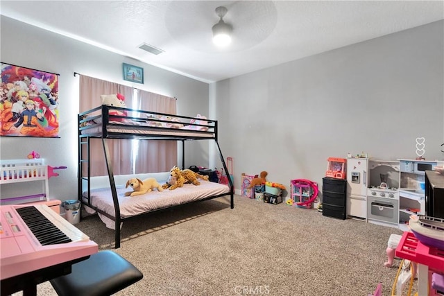 carpeted bedroom with ceiling fan