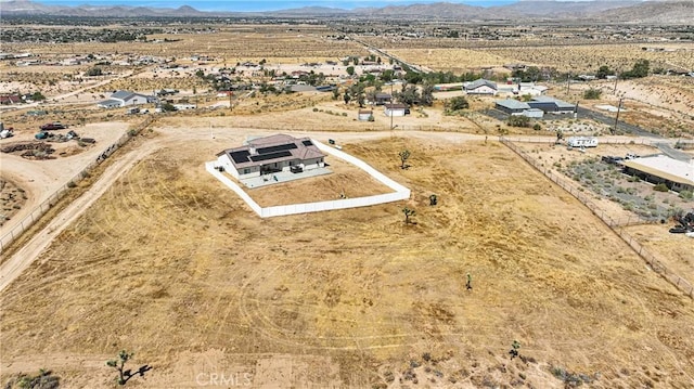 birds eye view of property featuring a mountain view