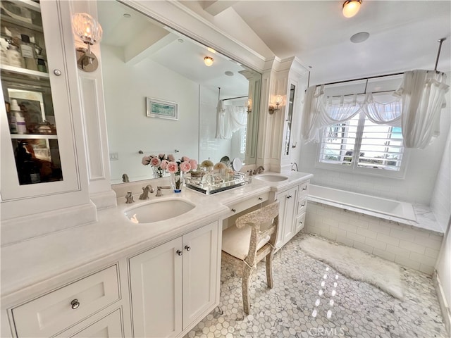 bathroom with tile patterned flooring, vaulted ceiling, decorative columns, shower with separate bathtub, and vanity