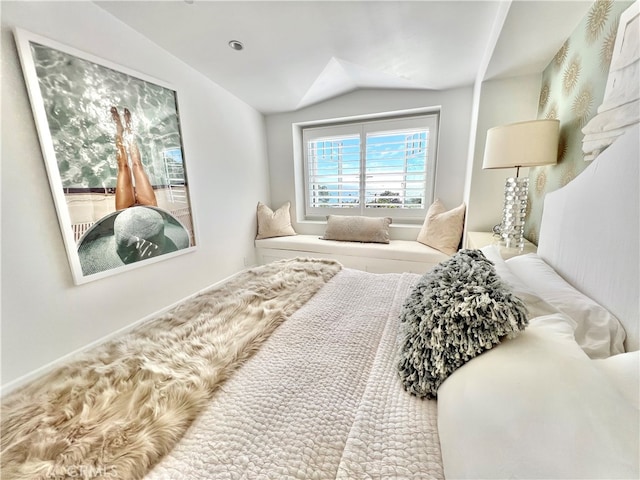 bedroom with lofted ceiling