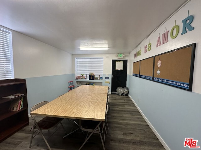 dining space with dark wood-type flooring