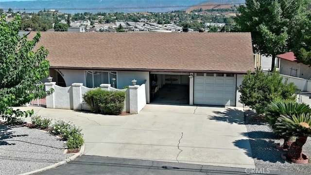 ranch-style house featuring a garage