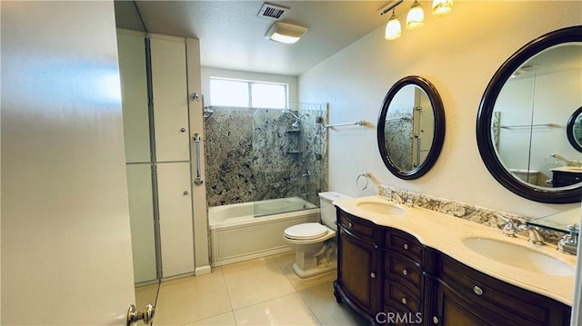 full bathroom with tile patterned floors, shower / bath combination with glass door, vanity, and toilet