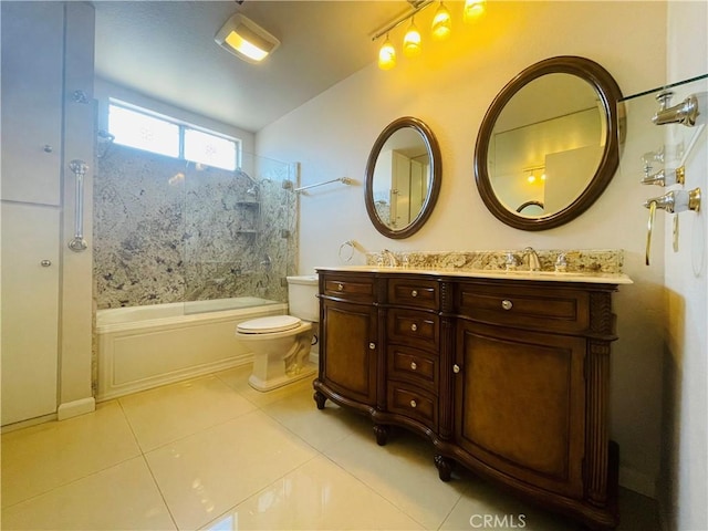 full bathroom with toilet, vanity, tiled shower / bath, and tile patterned flooring