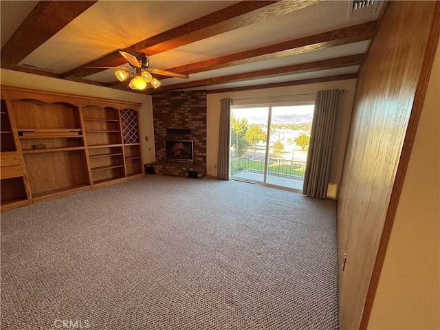 unfurnished living room featuring ceiling fan, a brick fireplace, and carpet flooring