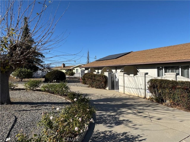 view of home's exterior featuring solar panels