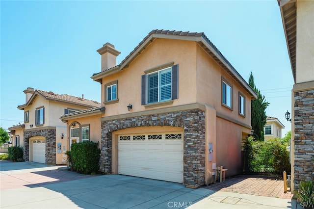 mediterranean / spanish-style house featuring a garage