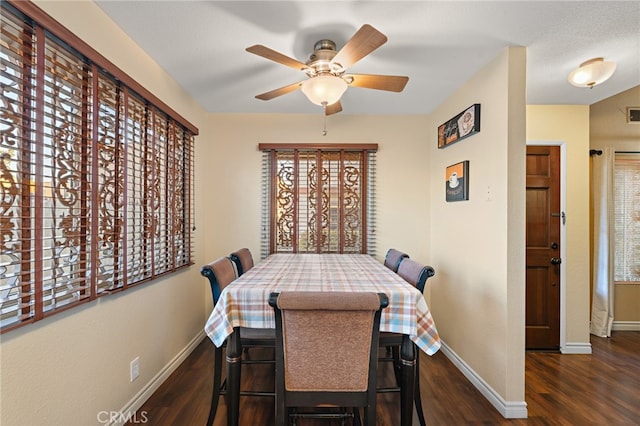 dining area with dark hardwood / wood-style flooring and ceiling fan