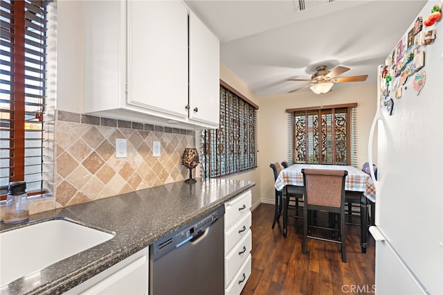 kitchen featuring white cabinetry, white refrigerator, a healthy amount of sunlight, stainless steel dishwasher, and dark hardwood / wood-style floors