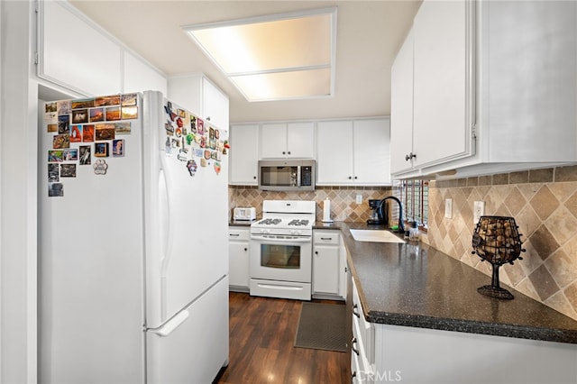 kitchen featuring sink, white cabinets, white appliances, backsplash, and dark hardwood / wood-style flooring