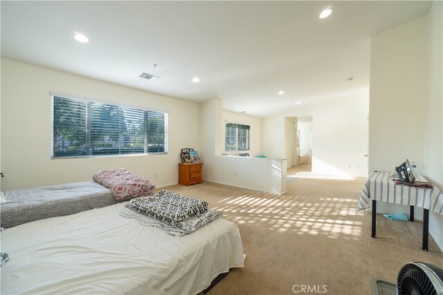 carpeted bedroom featuring lofted ceiling