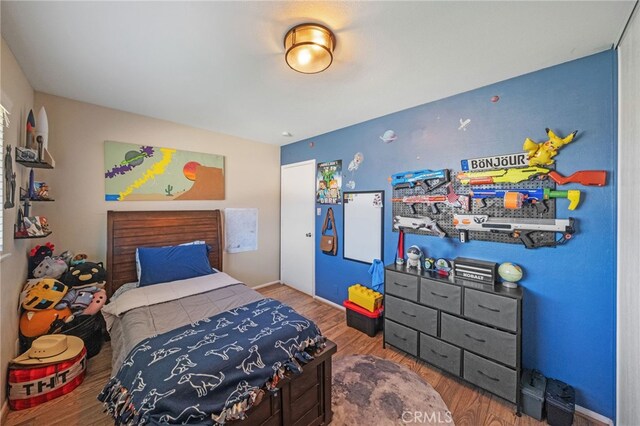 bedroom featuring wood-type flooring