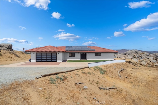 view of front of property with solar panels