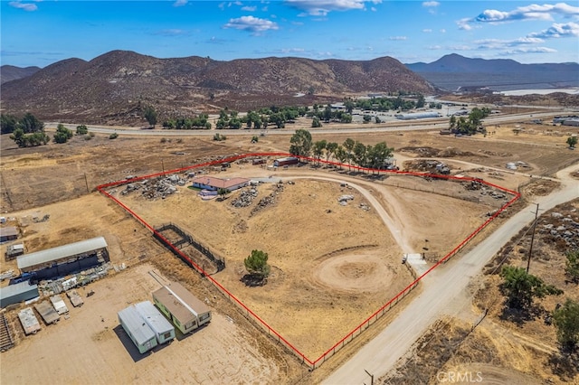 drone / aerial view with a mountain view and a rural view