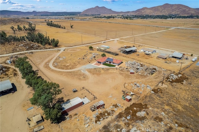 drone / aerial view with a mountain view and a rural view