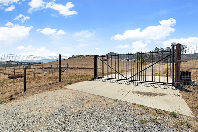 view of gate featuring a rural view