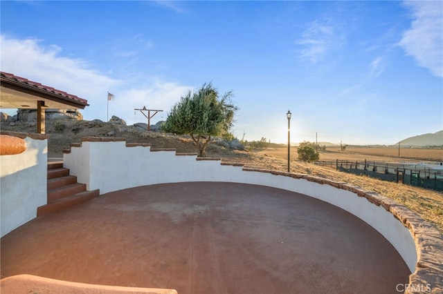 view of patio / terrace with a rural view