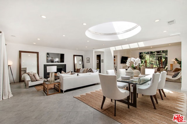 dining area featuring a raised ceiling