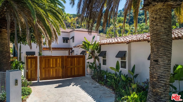 view of gate featuring a garage