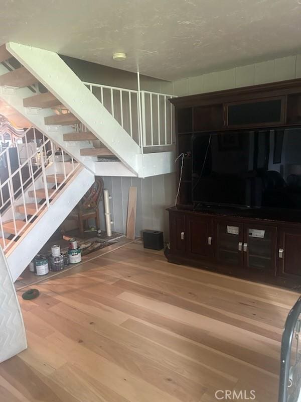 unfurnished living room with hardwood / wood-style floors