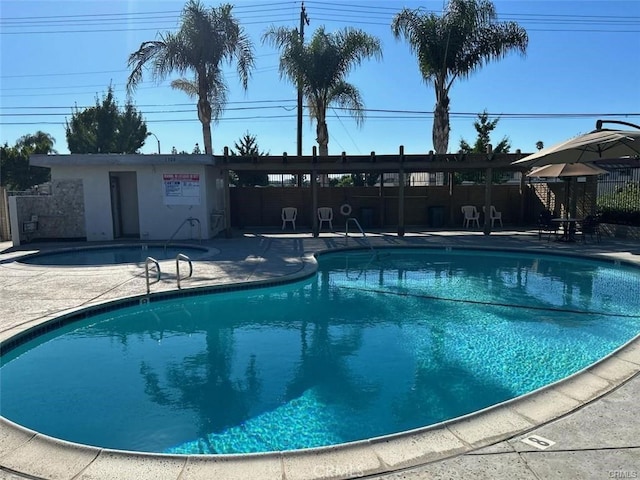 view of swimming pool featuring a patio