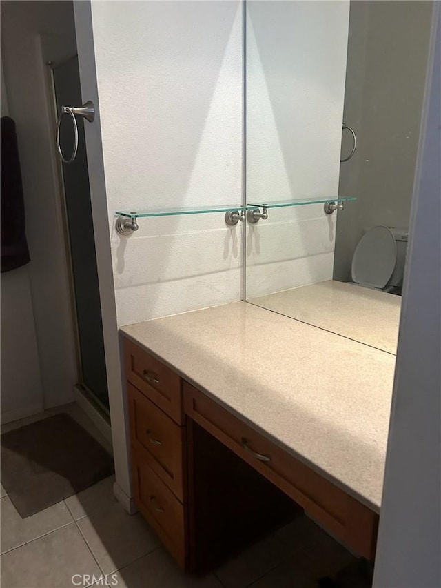 bathroom with tile patterned floors and vanity