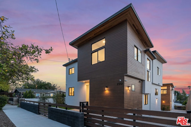 view of property exterior at dusk